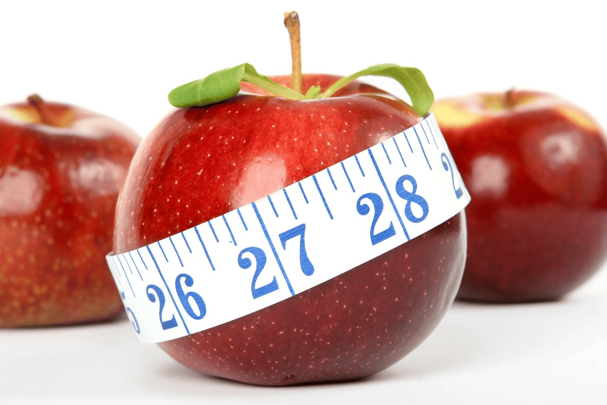 Apple with measuring tape. Lose 30 pounds in a 30 days. 
